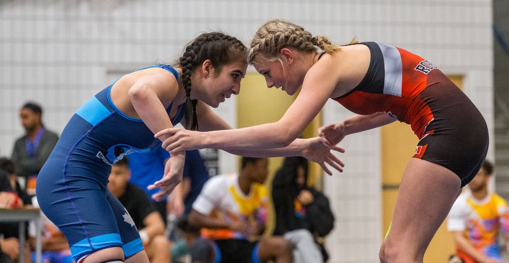 Two female wrestlers facing off in the ring.